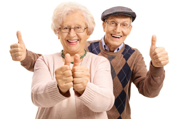 überglückliche senioren halten die daumen - daumen fotos stock-fotos und bilder
