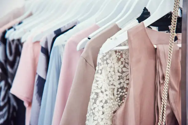 Photo of Details of bright beautiful pastel tones dress collection in show room