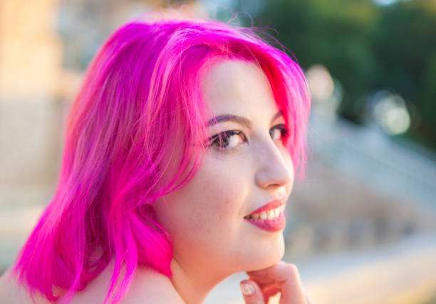 istock Beautiful young woman in pink 688951986