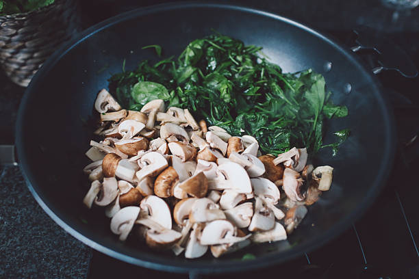 istock Close-Up Of Chopped Mushrooms And Spinach In Container 688953431