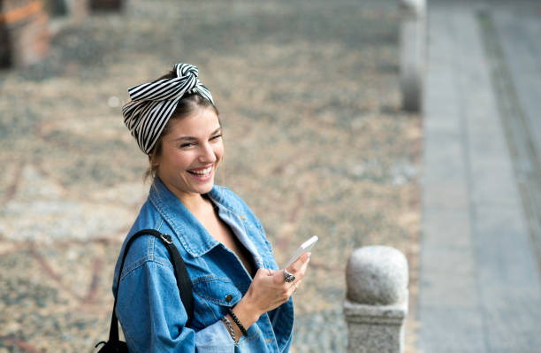 istock Beautiful woman using phone. 688959654
