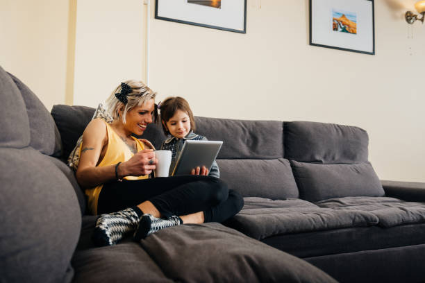 istock Single parent with young child at home 688959966