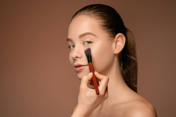 istock Beautiful female eyes with make-up and brush 688962912