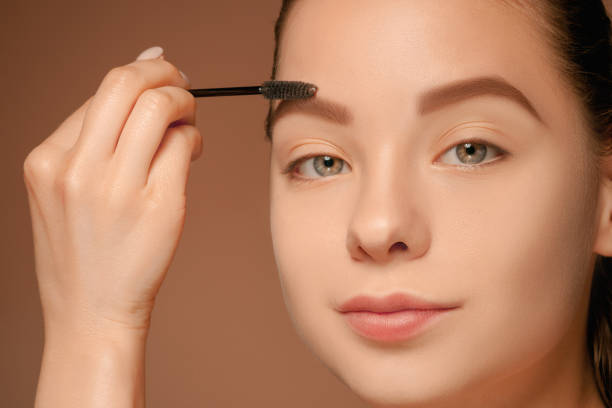 istock Beautiful female eyes with make-up and brush 688966624
