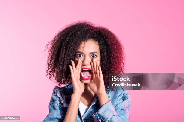 Surprised Young Afro Woman Shouting Stock Photo - Download Image Now - Adult, Adults Only, African-American Ethnicity