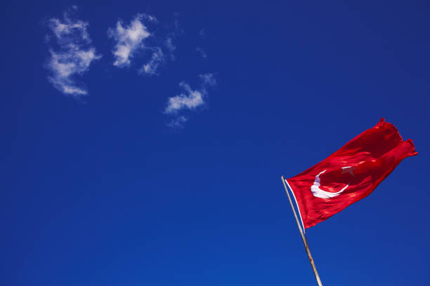 istock Turkish flag on wind with pure blue sky on background 688969690