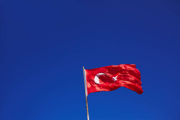 istock Turkish flag on wind with pure blue sky on background 688969696