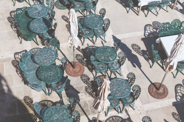 Close up wicker sunshade with blue sky backdrop.