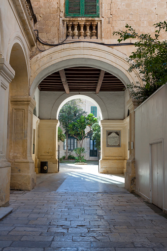 Cadiz arch Arco de los Blanco in San Juan de Dios street of Andalusia in Spain