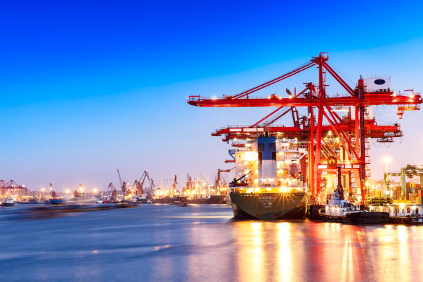 istock Containers loading by crane in the morning,trade port,shipping 688973808