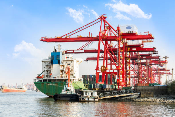 istock Containers loading by crane,trade port,shipping 688974002