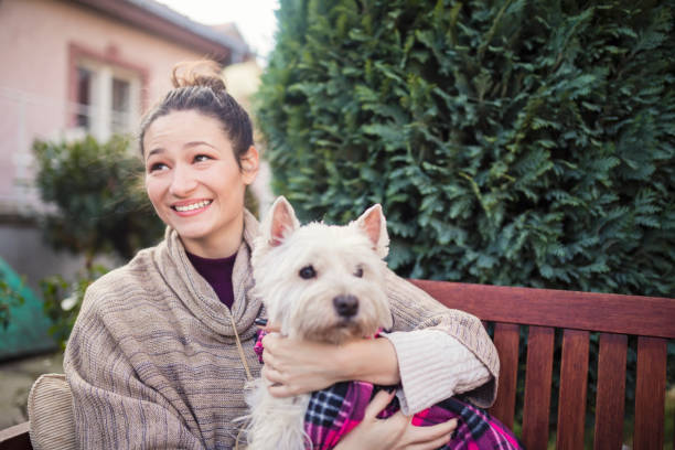 istock Beautiful young woman with dog 688974132