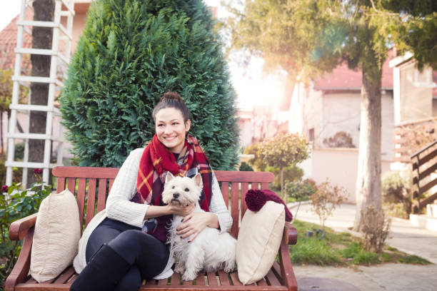 istock Beautiful young woman with dog 688974156