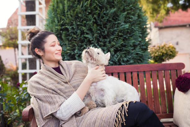 istock Beautiful young woman with dog 688974240