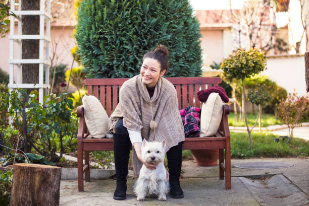 istock Beautiful young woman with dog 688974250