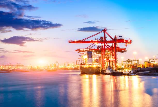 istock Containers loading by crane in the morning,trade port,shipping 688976742