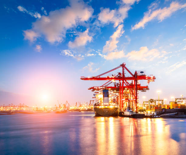 istock Containers loading by crane in the morning,trade port,shipping 688976950