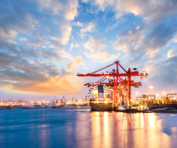 istock Containers loading by crane in the morning,trade port,shipping 688980086