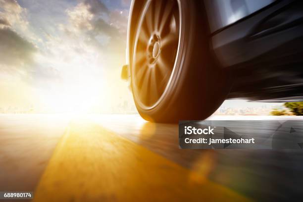 Low Angle Side View Of Car Stock Photo - Download Image Now - Car, Tire - Vehicle Part, Road