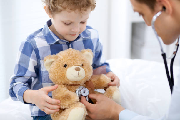 istock Doctor examining a child  patient by stethoscope 688980804