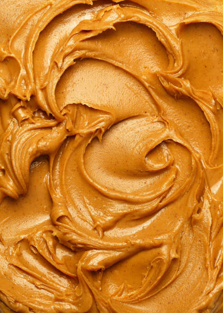 Peanut butter spread Swirls of creamy peanut butter spread. peanutbutter stock pictures, royalty-free photos & images