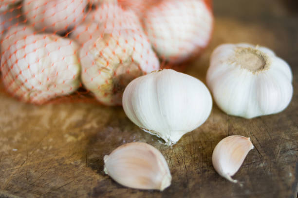 istock fresh garlic on wooden background 688984722