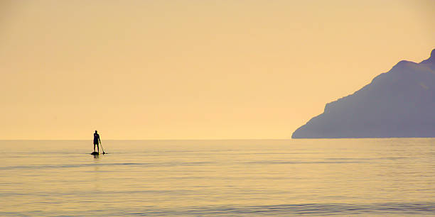 istock Silhouette Boating At Calm Sea 688986897