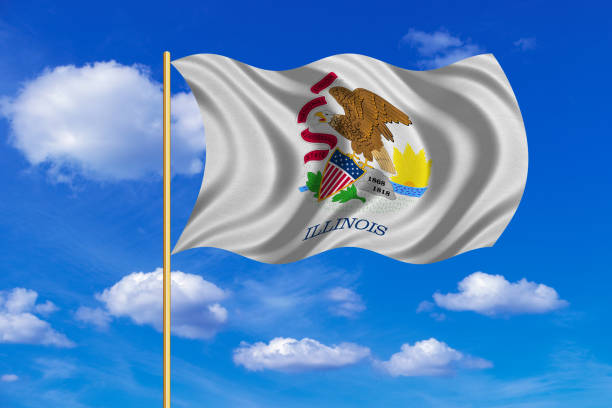 istock Flag of Illinois waving on blue sky background 688987528