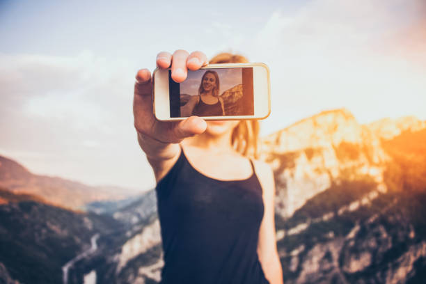 istock Beautiful girl taking a selfie 688992692