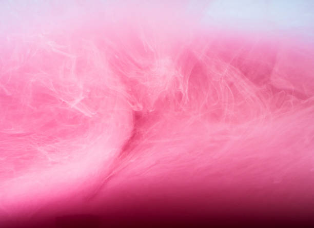 istock Abstract colored background. Pink smoke, ink in water, the patterns of the universe. Abstract movement, frozen multicolor flow of paint. Horizontal photo with soft focus, blurred backdrop 688993566