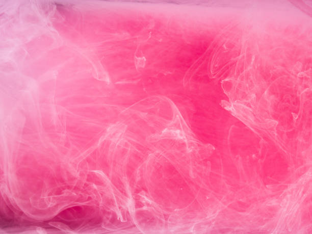istock Abstract colored background. Pink smoke, ink in water, the patterns of the universe. Abstract movement, frozen multicolor flow of paint. Horizontal photo with soft focus, blurred backdrop 688993608