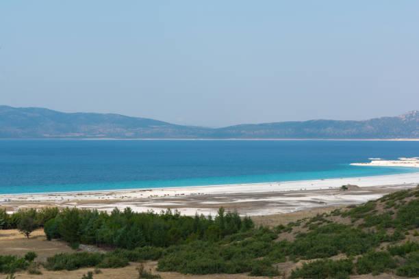 istock White sandy beach and sky in Lake Salda Turkey 688997222