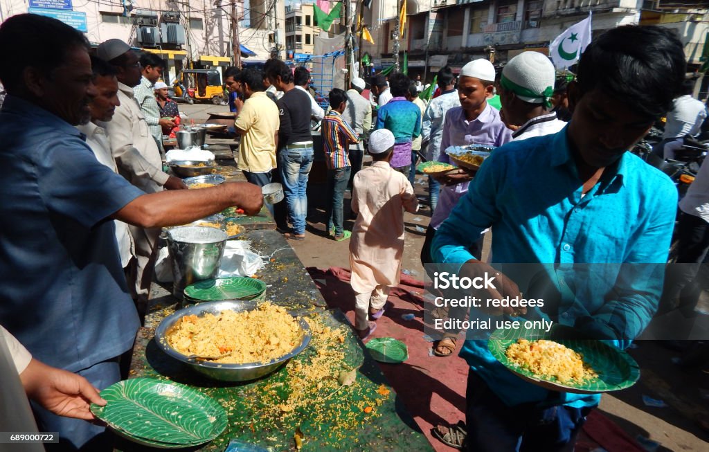 Indian Muslims distribute the public food a ritual on Milad un Nabi birthday of Prophet Mohammed, Hyderabad,India. HYDERABAD,INDIA-DECEMBER 12: Indian Muslims distribute the public food a ritual on Milad un Nabi birthday of Prophet Mohammed on December 12,2016 in Hyderabad,India. Asia Stock Photo