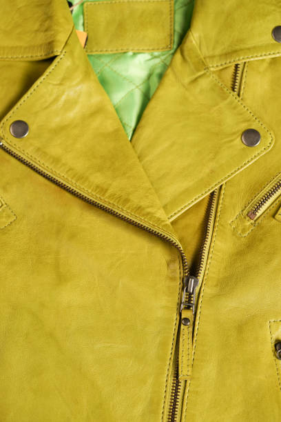 istock Green leather jacket. Leather jacket macro details. Jacket zippers and pockets 689003738