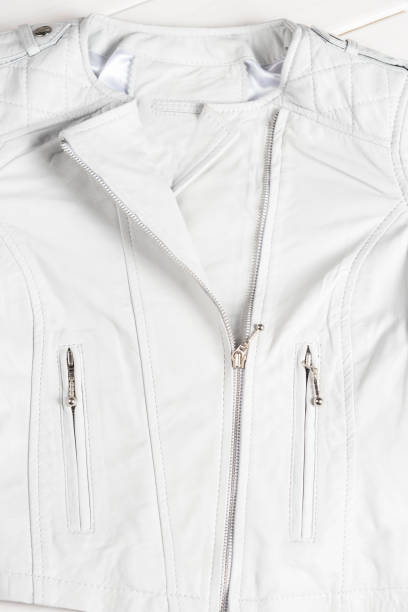 istock White leather jacket on white background. Leather jacket macro details. Jacket zippers and pockets 689003812