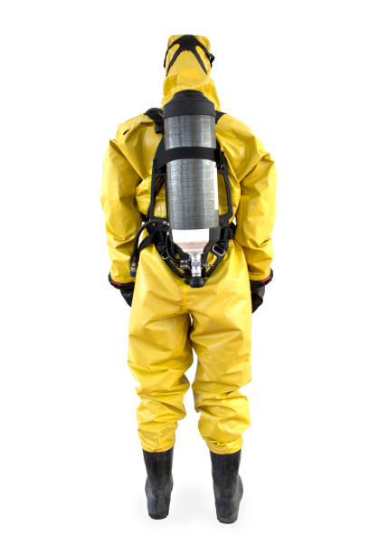 Worker in a protective suit and breathing apparatus isolated stock photo