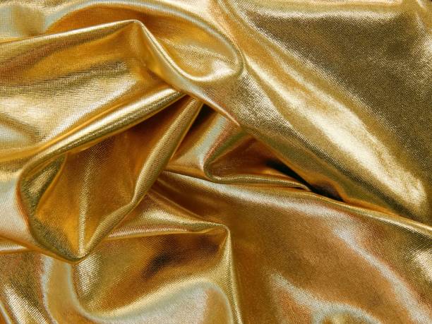 istock Gold satin material close-up 689008454