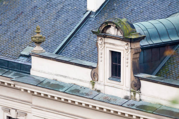 Old roof with vintage windows and ornamental cornice. Old roof with vintage windows and ornamental cornice. constitucion photos stock pictures, royalty-free photos & images