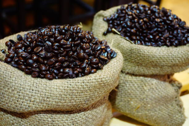 istock Cloth bag full of fresh coffee beans 689015590