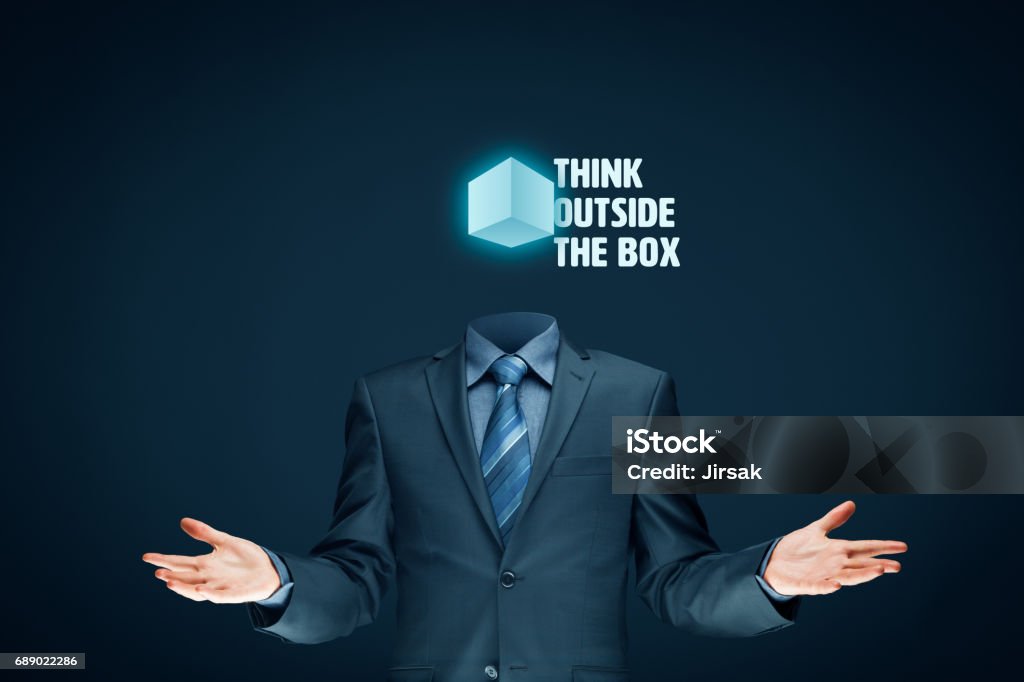 Think outside the box concept Think outside the box concept. Open minded businessman with box and text think outside the box. Adult Stock Photo