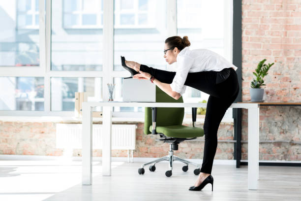 istock Calm woman making exercise in office 689026504