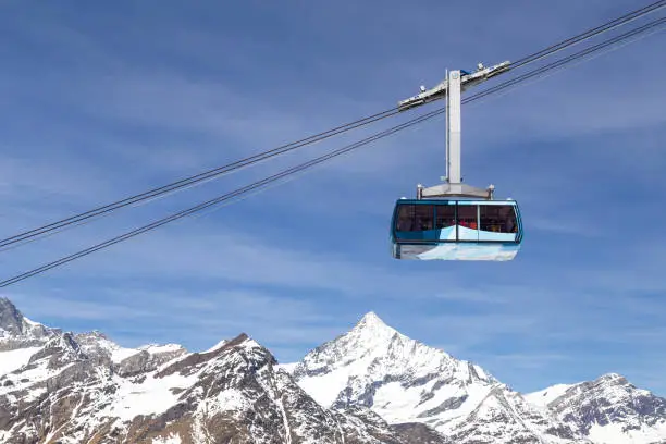 Zermatt, Switzerland - April 12, 2017: A cable car in the Swiss Alps on it's way to the mountain top