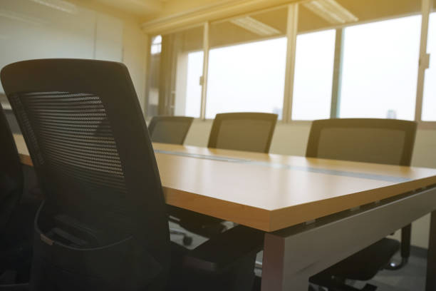 istock wooden table in meeting room white board sunlight from window 689032616