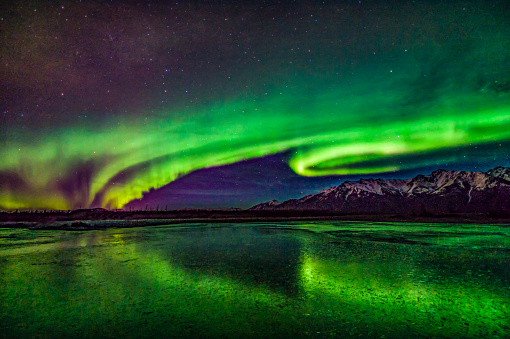 Northern Lights over the Knik River and Matanuska Mountains, Alaska.