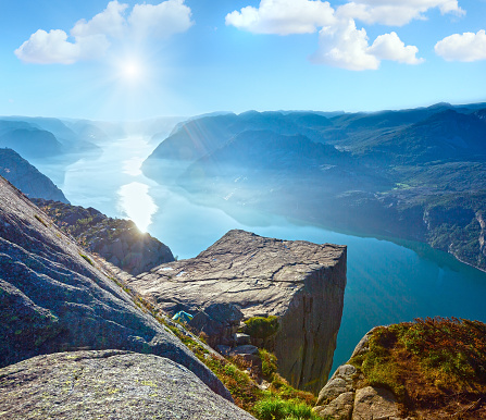 Famous morning sunshiny Preikestolen massive cliff (Norway, Lysefjorden summer morning view)