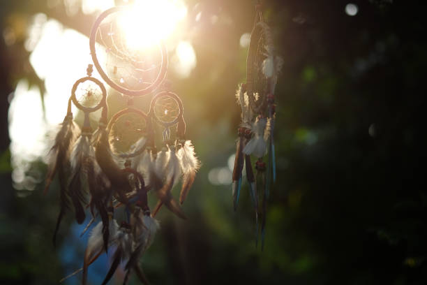 istock Soft focus Dream Catcher with a flare from the sun set on the background bokeh nature. Native american dream catcher. (Vintage style) boho chic, ethnic amulet. 689048558
