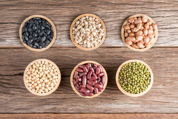 istock Mixed beans in wood bowl on wood background. 689052072