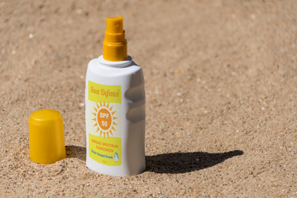 istock Sunscreen, sun tan lotion on the beach 689052082