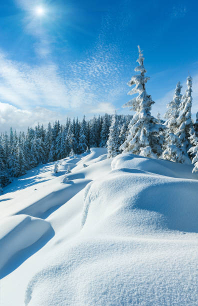 istock Snowdrifts on winter snow covered mountainside 689055626