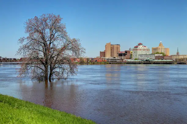 Flooded Ouachita River along the banks of downtown Monroe.  Monroe is the eighth-largest city in the U.S. state of Louisiana. it is the parish seat of Ouachita Parish